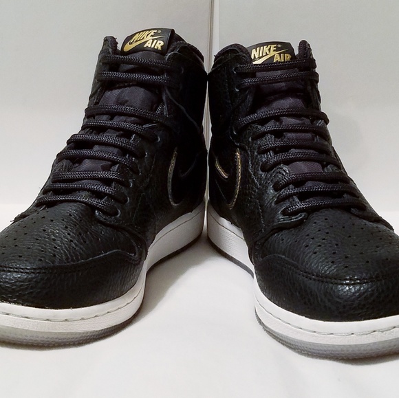 black jordans with gold trim